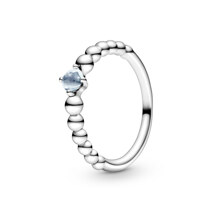 Sterling silver ring with treated aqua blue topaz