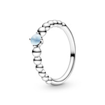 Sterling silver ring with treated sky blue topaz